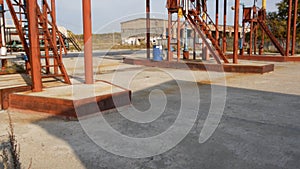 Oil pumps at the oil depot. Stock. Old tank farm on a Sunny day. Fuel industry concept