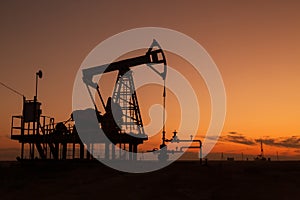 Oil pumps at sunset,  industrial oil pumps equipment