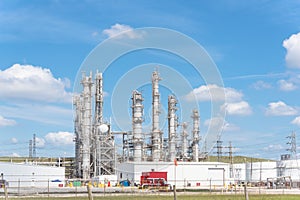 Oil refinery column un er cloud blue sky in Pasadena, Texas, USA