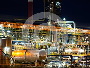 Oil refinery at dusk. Communications in a refinery - refinery equipment