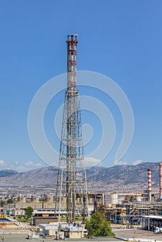 Oil refinery gas flare from a tall chimney