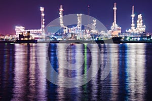 Oil refinery industrial plant at night