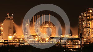 Oil refinery industrial plant at night, Thailand