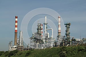 Oil refinery plant against the blue sky