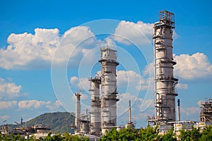 The oil refinery plant form industry zone ,which the factory - petrochemical plant, Shot from drone of Oil refinery as blue sky