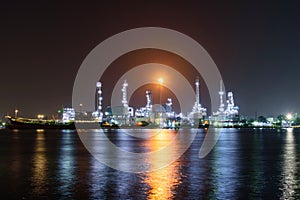 Oil refinery at the river in night time