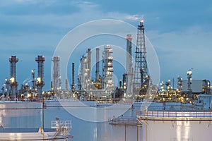 Oil refinery and storage tanks at twilight