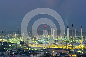 Oil refinery and storage tanks at twilight