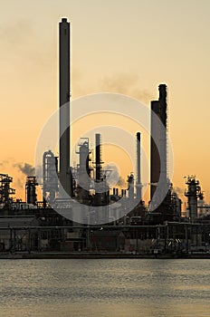 Oil refinery at sunset