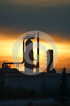 Oil refinery at sunset