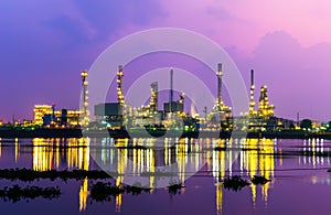 Oil refinery at twilight, heavy industry scene