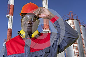 Oil Refinery Worker in Personal Protective Equipment Looking At Camera