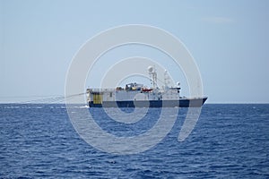 Oil research and exploration seismic vessel or ship in sea photo