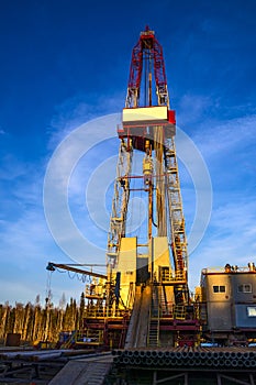 Oil rig at background dawn .