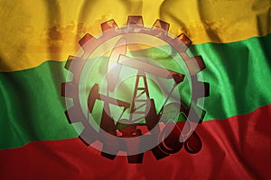 Oil rig on the background of the flag of Lithuania. Mixed environment. The concept of oil production, minerals, development of new