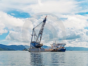 Oil rig in bay of tropical islands, exploration and production of oil in ocean