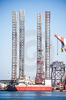 Oil rig moored at a commercial dock