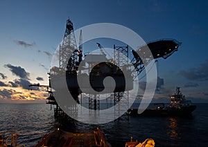 Oil rig platform with beautiful sky during sunset
