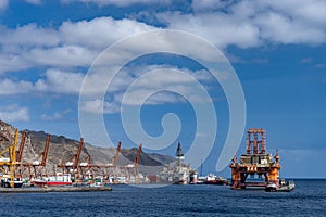 Oil rig platform at dawn in the port of Santa Cruz de Tenerife Canary Islands Spain. Anaga mountains in background