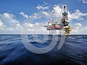 Oil rig platform at sea with beautiful cloud