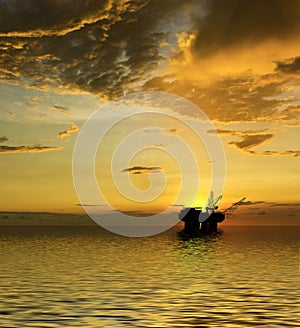 Oil Rig silhouette with majestic ocean and sunset