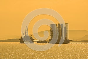 Oil rig during sunset in Caspi
