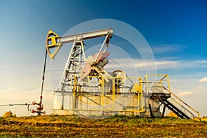 Working oil pump. Oil industry equipment. Oilfield.