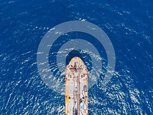 Oil ship chemical tanker sails blue sea. Aerial top view. Concept export