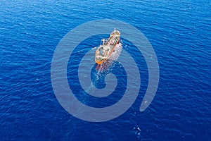 Oil ship chemical tanker sails blue sea. Aerial top view. Concept export