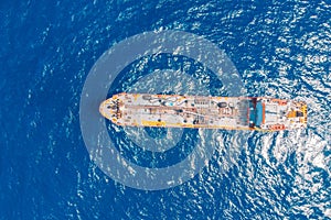 Oil ship chemical tanker sails blue sea. Aerial top view. Concept export