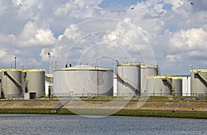 Oil silos along a canal