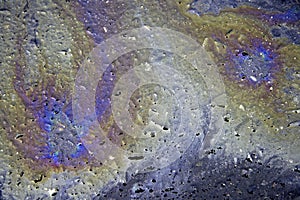 Oil slick on tar road photo