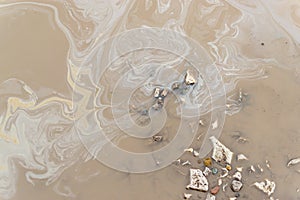 Oil Spill on Dirty Grimy Muddy Water