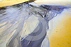 Oil spills released on the sand are creative works of art.