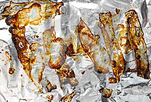 Oil stain on foil paper background after cooking in the oven and on the grill