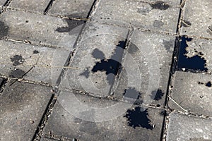 Oil-stained tiles in the parking lot