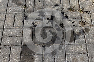 Oil-stained tiles in the parking lot