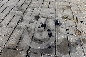 Oil-stained tiles in the parking lot