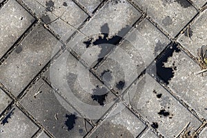 Oil-stained tiles in the parking lot