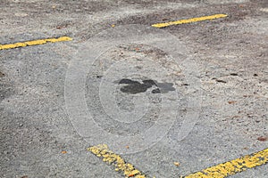 Oil stains pollution on parking spot surface