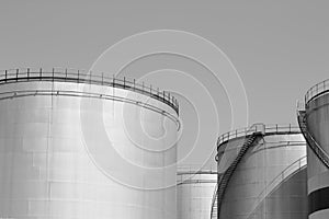 Oil storage tank with metal bridge and stairs