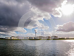 Oil storage tanks and exhaust stack of power station Hemweg in W