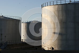 Oil storage tanks sky blue