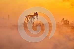 The oil sucking machine in fog landscape in Daqing oil field