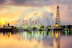 Oil tank ship mooring in oil refinery industry at twilight time