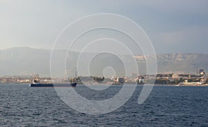 Oil tanker anchored in the area in front of Split, Croatia harbour, town seen in the distance. Second largest city in the republic