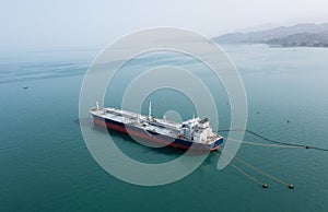 Oil Tanker Anchored Off Coastal City