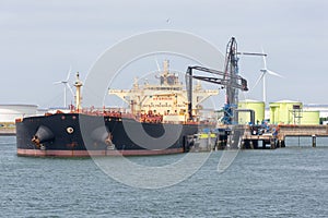 Oil tanker in Dutch harbor Rotterdam, biggest seaport of Europe