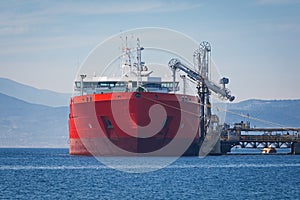Oil tanker at a tank storage facility, Greece. photo