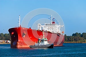 Oil tanker and a tugboat photo